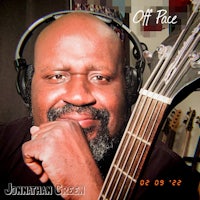 a man with headphones and a guitar